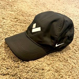 NIKE dri-fit tennis hat with “V” logo on front.
